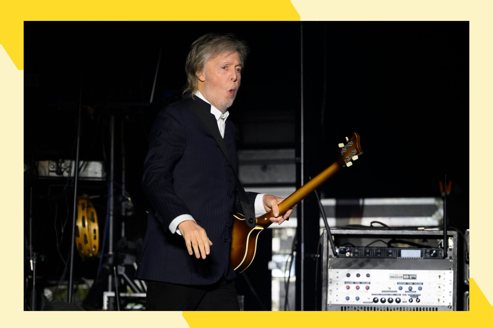 Paul McCartney feels himself while onstage.